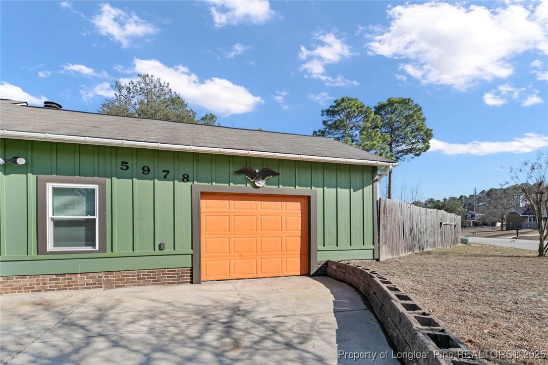 5978 Brookcliff Road Fayetteville, NC 28304 - Photo 33 of 38 a front view of a house with a yard and garage