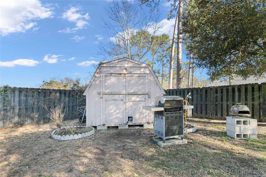 5978 Brookcliff Road Fayetteville, NC 28304 - Photo 35 of 38 a view of a chairs and table in the backyard