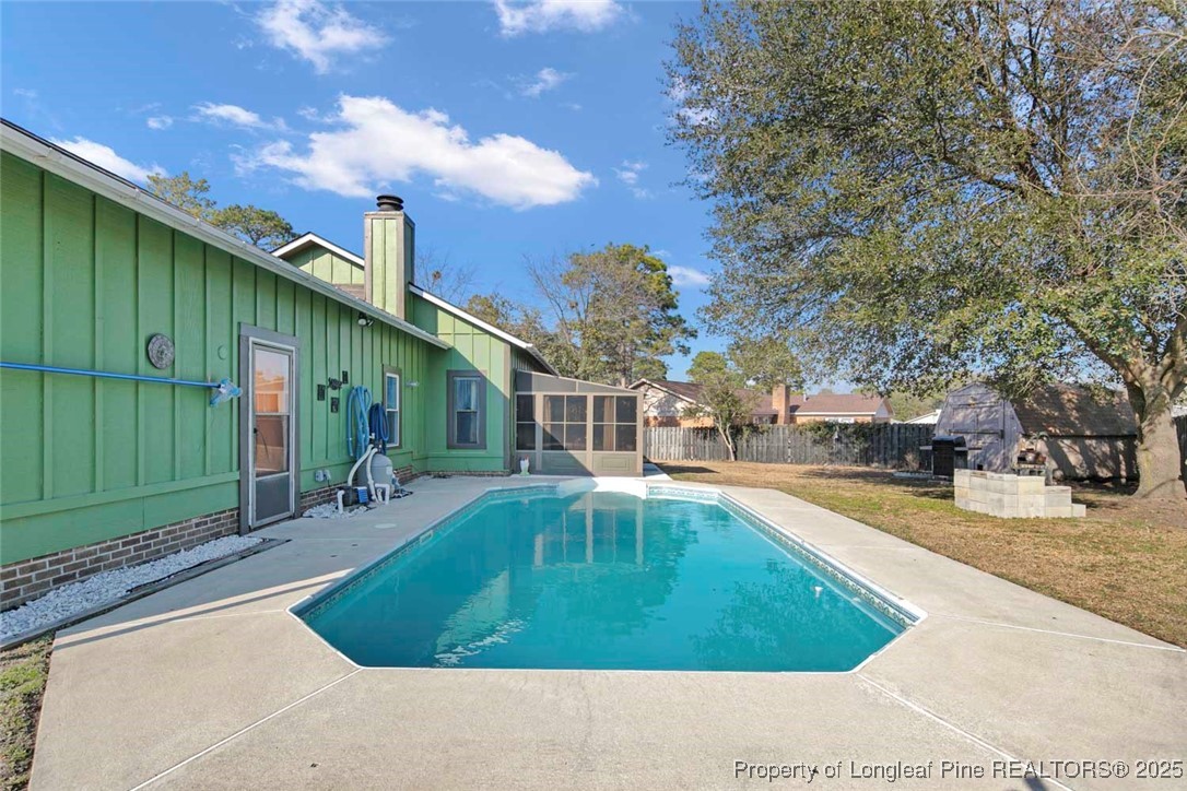 5978 Brookcliff Road Fayetteville, NC 28304 - Photo 37 of 38 a swimming pool with outdoor seating and yard