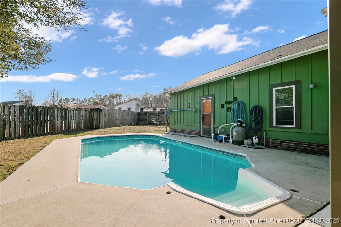 5978 Brookcliff Road Fayetteville, NC 28304 - Photo 5 of 38 a view of a swimming pool with a lounge chairs