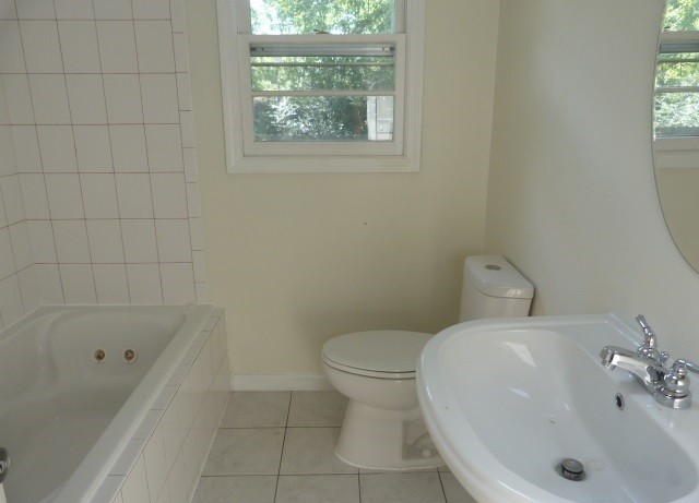 303 Willow Street Manchester, TN 37355 - Photo 11 of 15 a bathroom with a sink and a bathtub