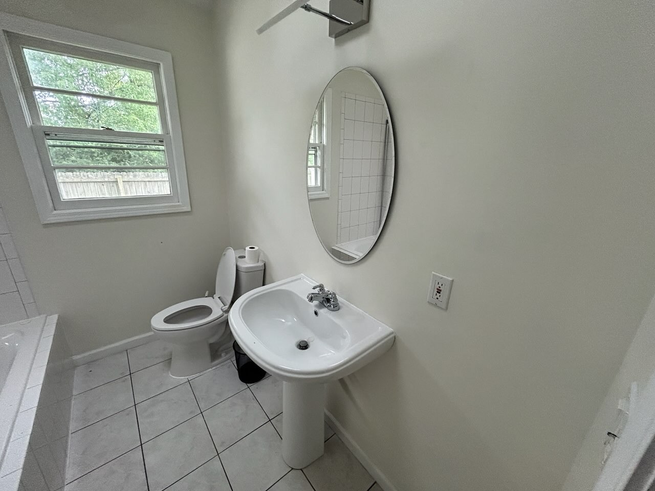 303 Willow Street Manchester, TN 37355 - Photo 12 of 15 a bathroom with a sink a toilet and a mirror