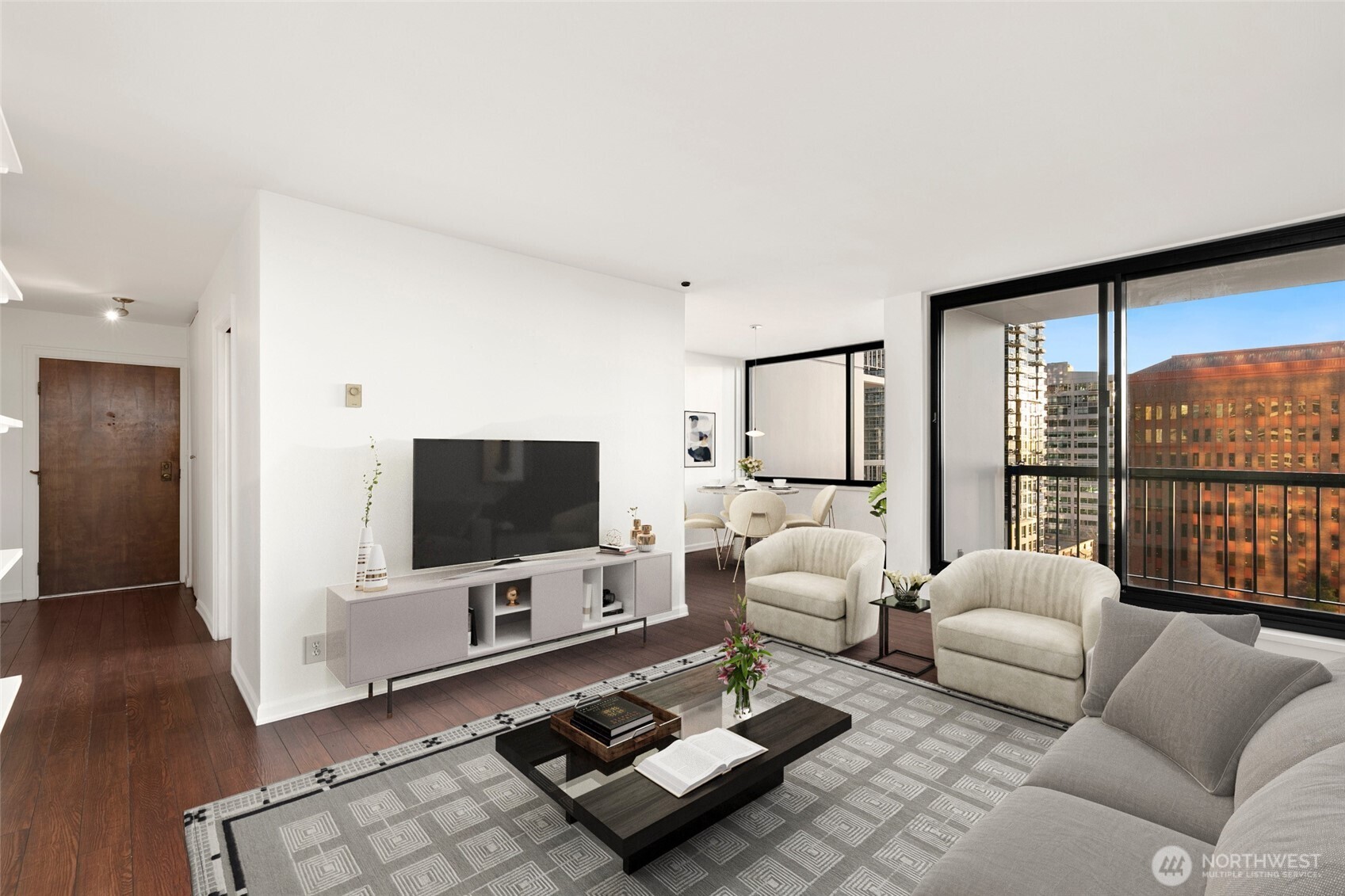 2100 3rd Avenue, Unit 1503 Seattle, WA 98121 - Photo 5 of 40 a living room with furniture a flat screen tv and a floor to ceiling window