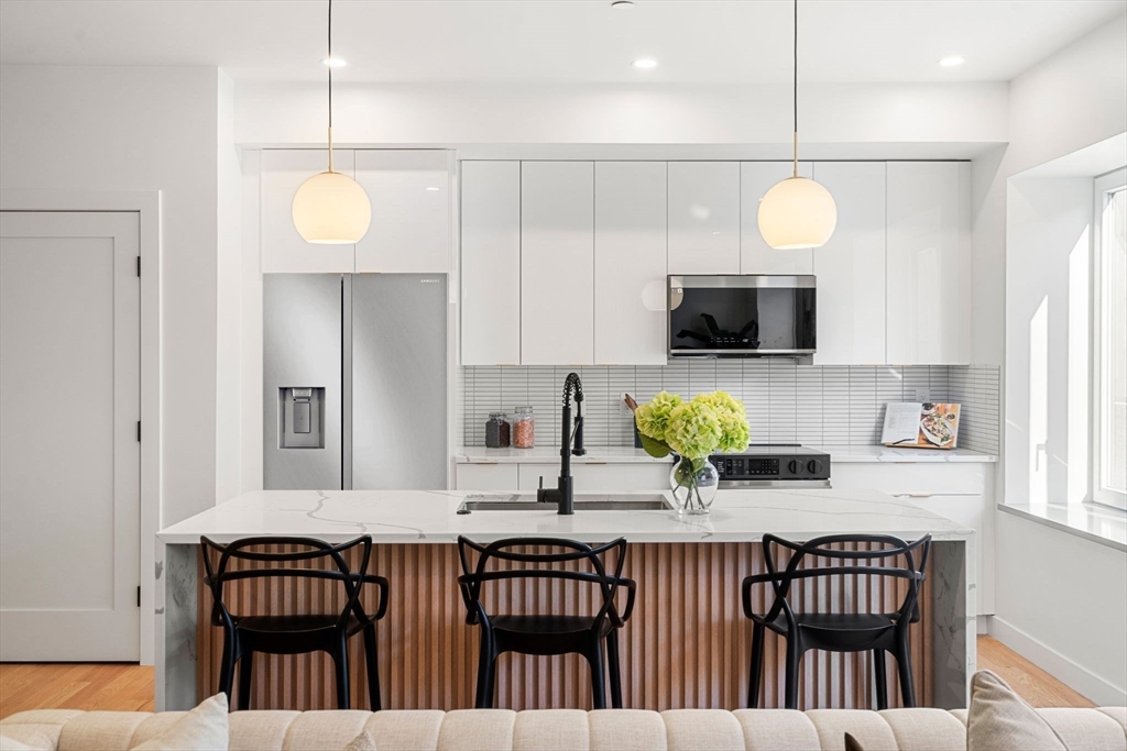 a view of kitchen and dining area with furniture
