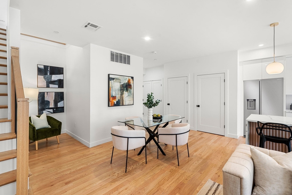 122 Washington Street, Unit 22 Weymouth, MA 02188 - Photo 11 of 37 a view of a livingroom with furniture and wooden floor