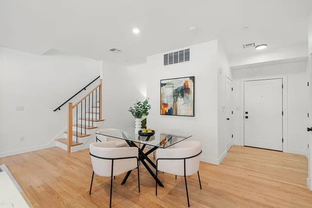 a view of a livingroom with furniture and wooden floor
