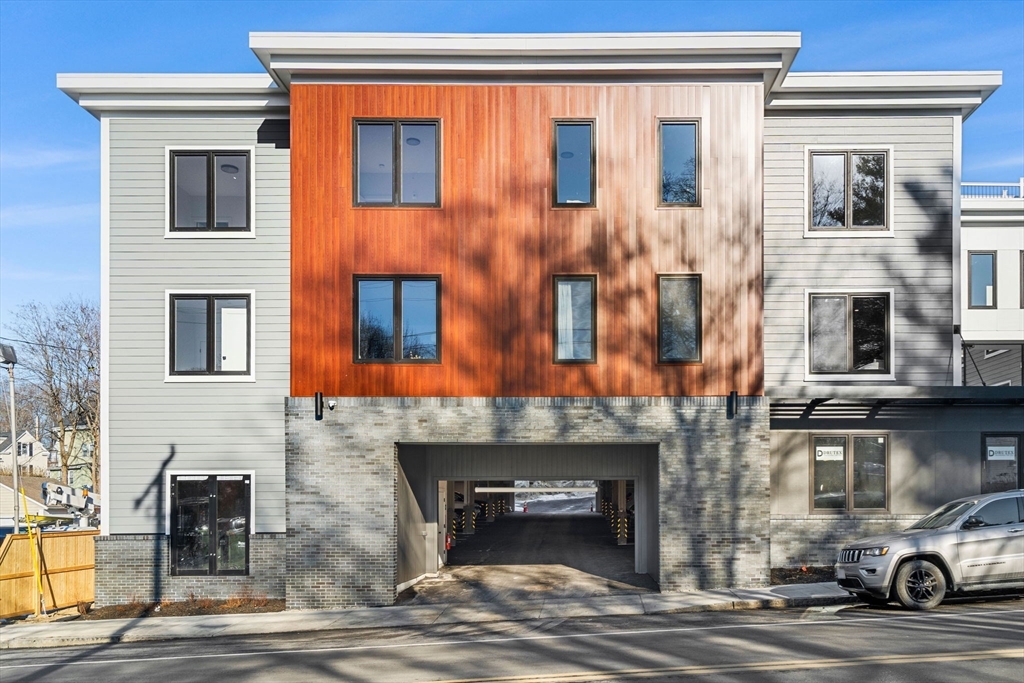 122 Washington Street, Unit 22 Weymouth, MA 02188 - Photo 35 of 37 a building with multiple windows