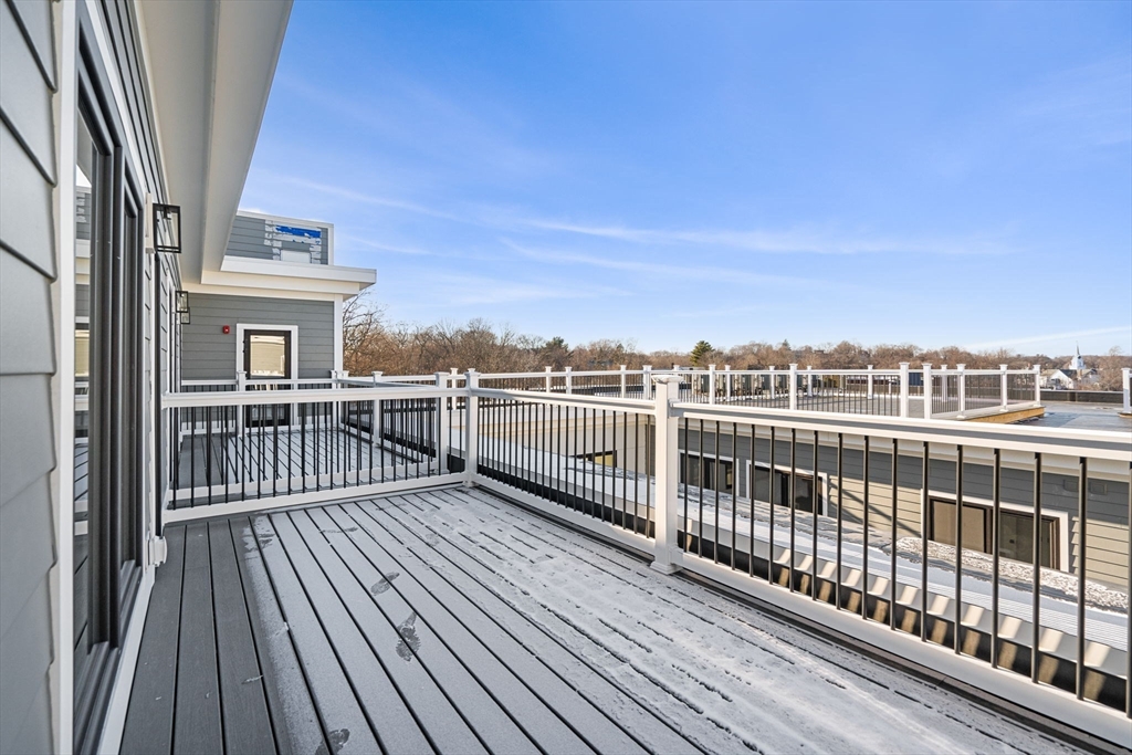 122 Washington Street, Unit 22 Weymouth, MA 02188 - Photo 37 of 37 a view of a balcony with wooden floor