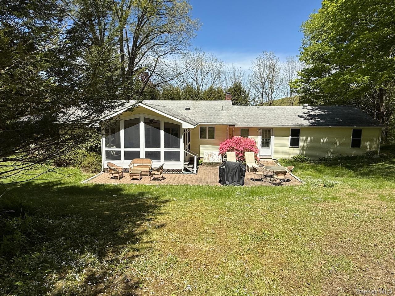 230 Cooper Road Millerton, NY 12546 - Photo 2 of 20 a front view of a house with garden