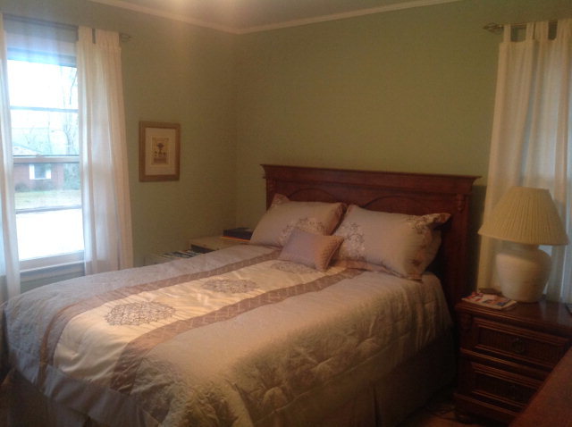 1945 Bayswater Road Macon, GA 31211 - Photo 14 of 24 a large bed sitting in a bedroom next to a window