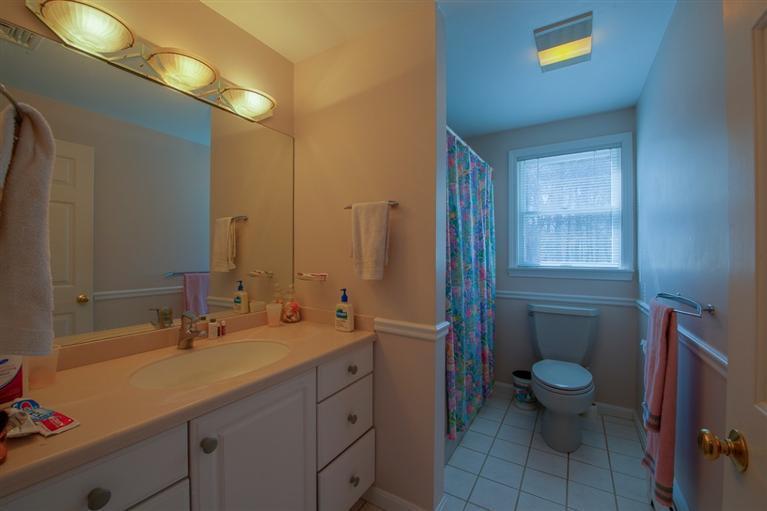 126 River Ridge Road Marstons Mills, MA 02648 - Photo 17 of 33 a bathroom with a sink a toilet a mirror and shower