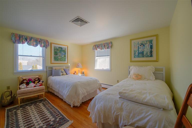 126 River Ridge Road Marstons Mills, MA 02648 - Photo 23 of 33 a bedroom with two beds and a window
