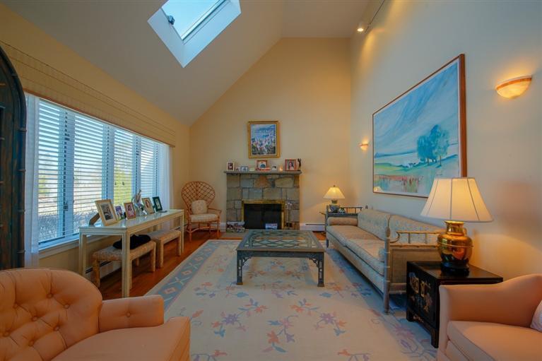 126 River Ridge Road Marstons Mills, MA 02648 - Photo 5 of 33 a living room with furniture and a fireplace