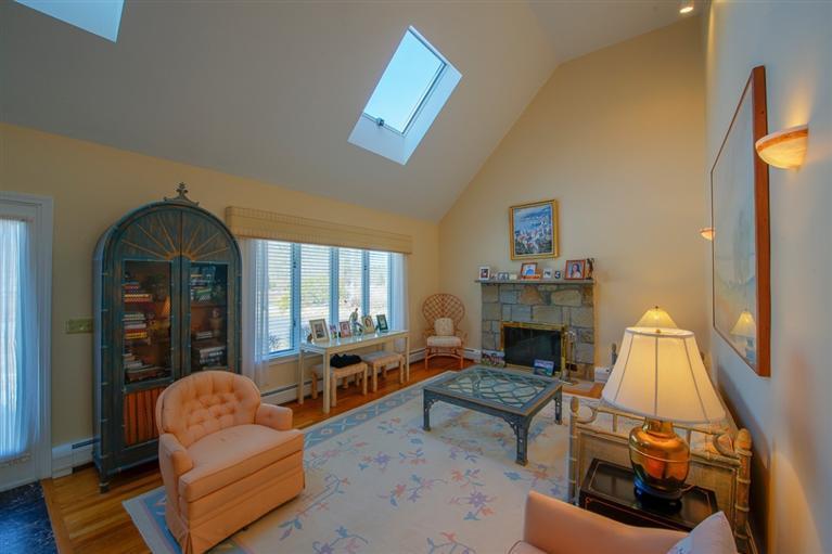 126 River Ridge Road Marstons Mills, MA 02648 - Photo 7 of 33 a living room with furniture fireplace and window