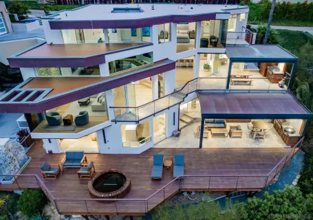 an aerial view of a house with a lake view