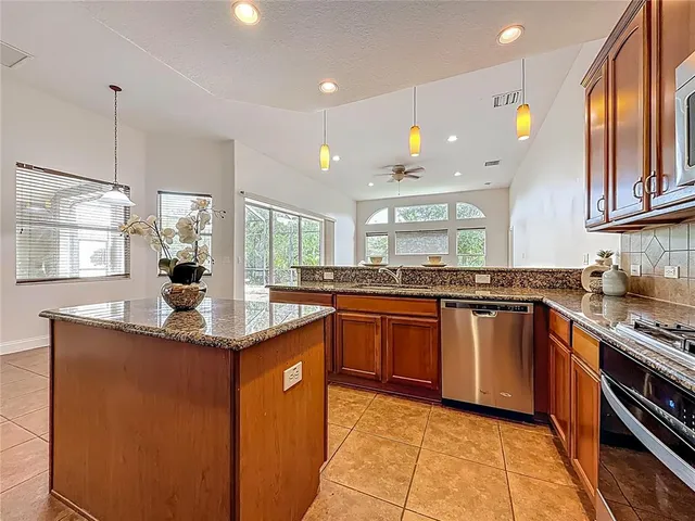 a view of a hallway with wooden floor and a cabinet