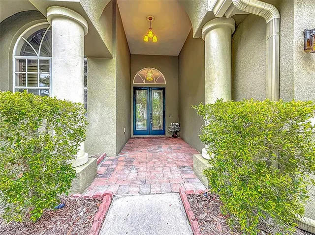 a view of an empty room with glass door