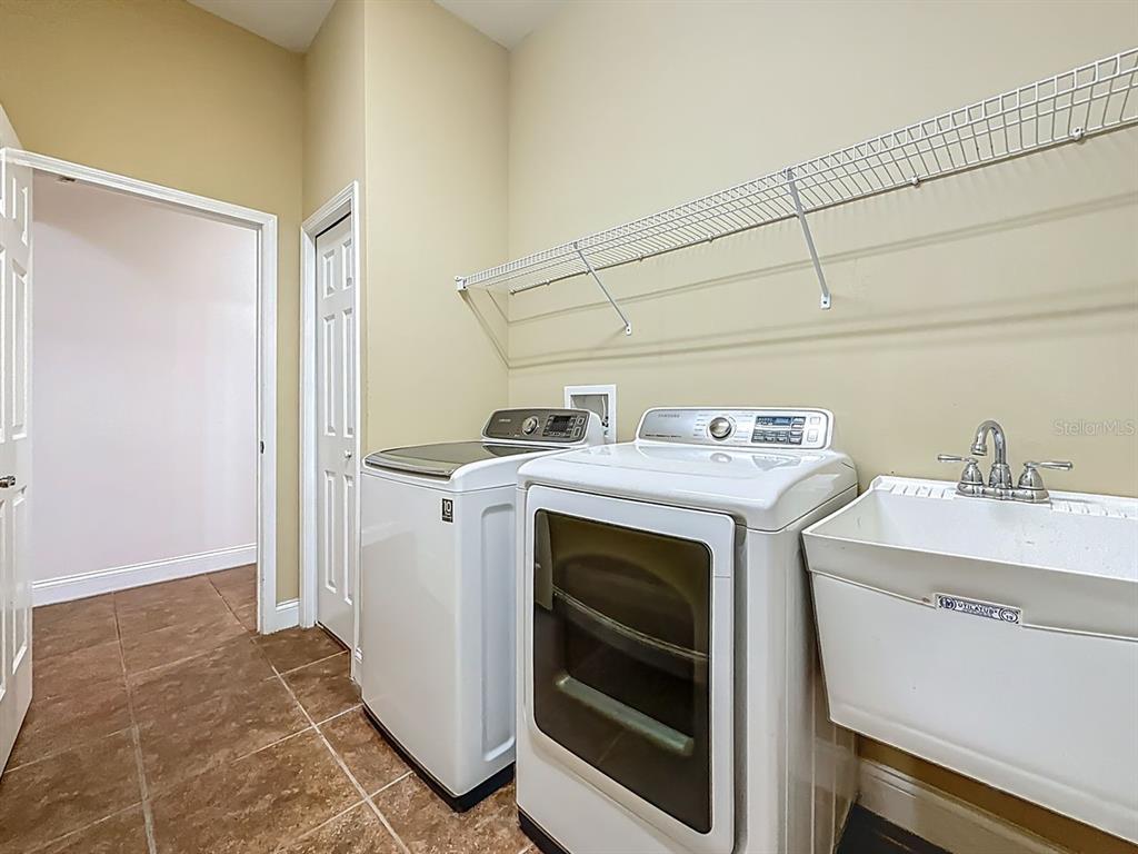 20626 Longleaf Pine Avenue Tampa, FL 33647 - Photo 44 of 86 a utility room with dryer and washer