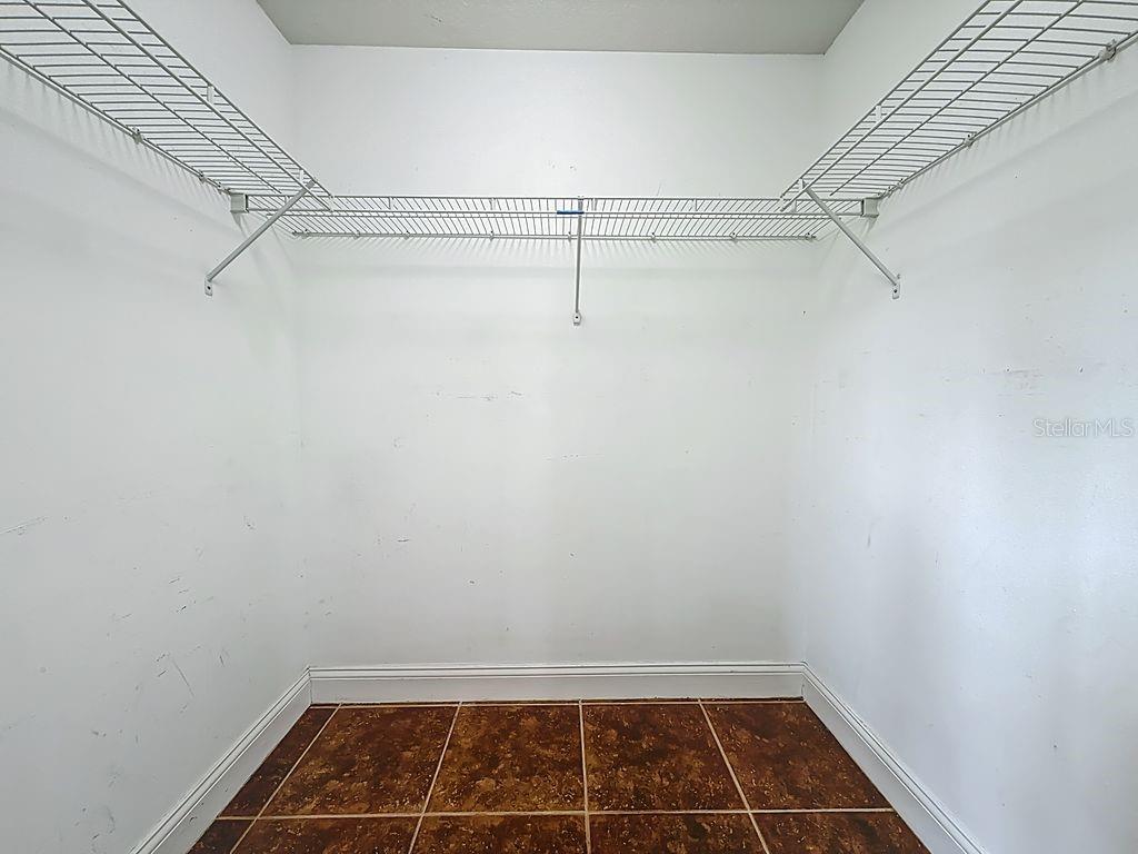 20626 Longleaf Pine Avenue Tampa, FL 33647 - Photo 47 of 86 a view of a room with racks on the wall