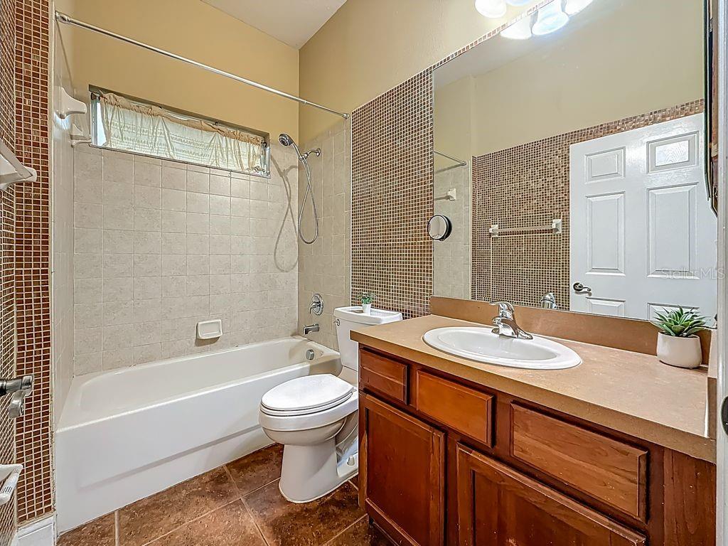 20626 Longleaf Pine Avenue Tampa, FL 33647 - Photo 48 of 86 a bathroom with a sink toilet tub and shower