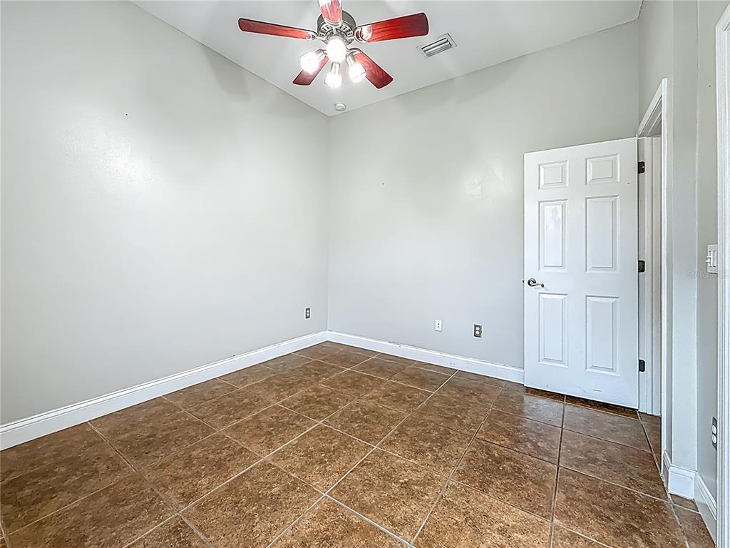 20626 Longleaf Pine Avenue Tampa, FL 33647 - Photo 51 of 86 an empty room with windows and fan