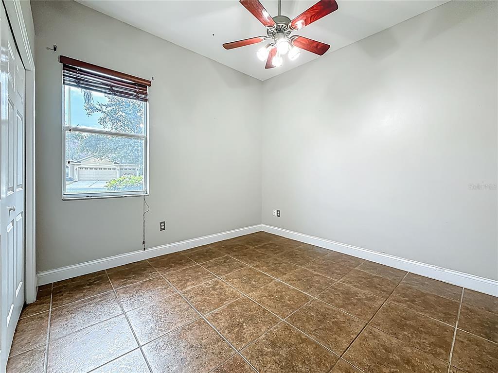 20626 Longleaf Pine Avenue Tampa, FL 33647 - Photo 52 of 86 an empty room with windows and fan