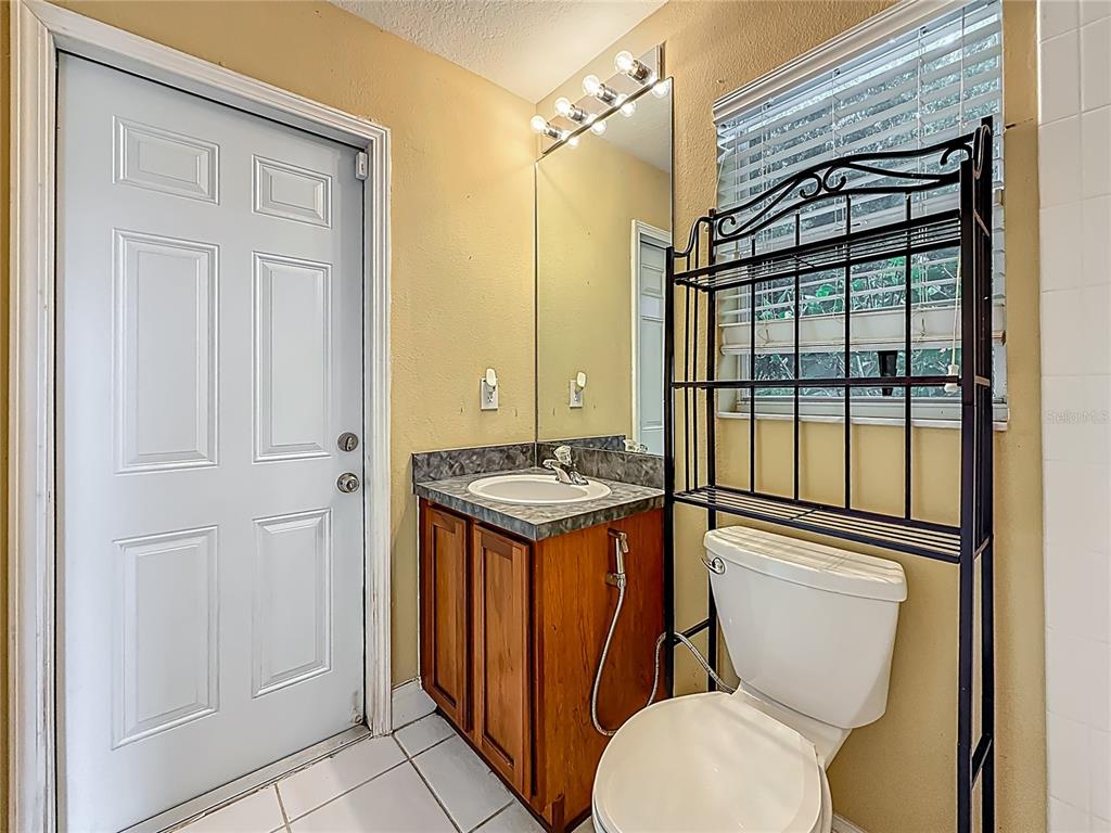20626 Longleaf Pine Avenue Tampa, FL 33647 - Photo 65 of 86 a bathroom with a toilet a sink and shower