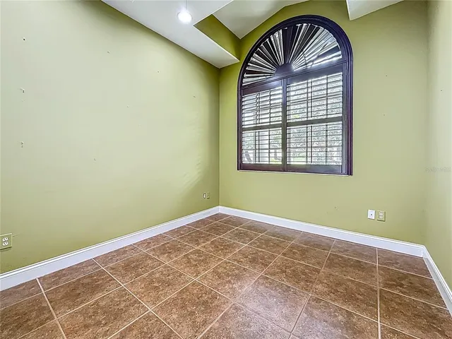 a kitchen with stainless steel appliances granite countertop wooden cabinets a stove top oven with granite countertops and cabinets