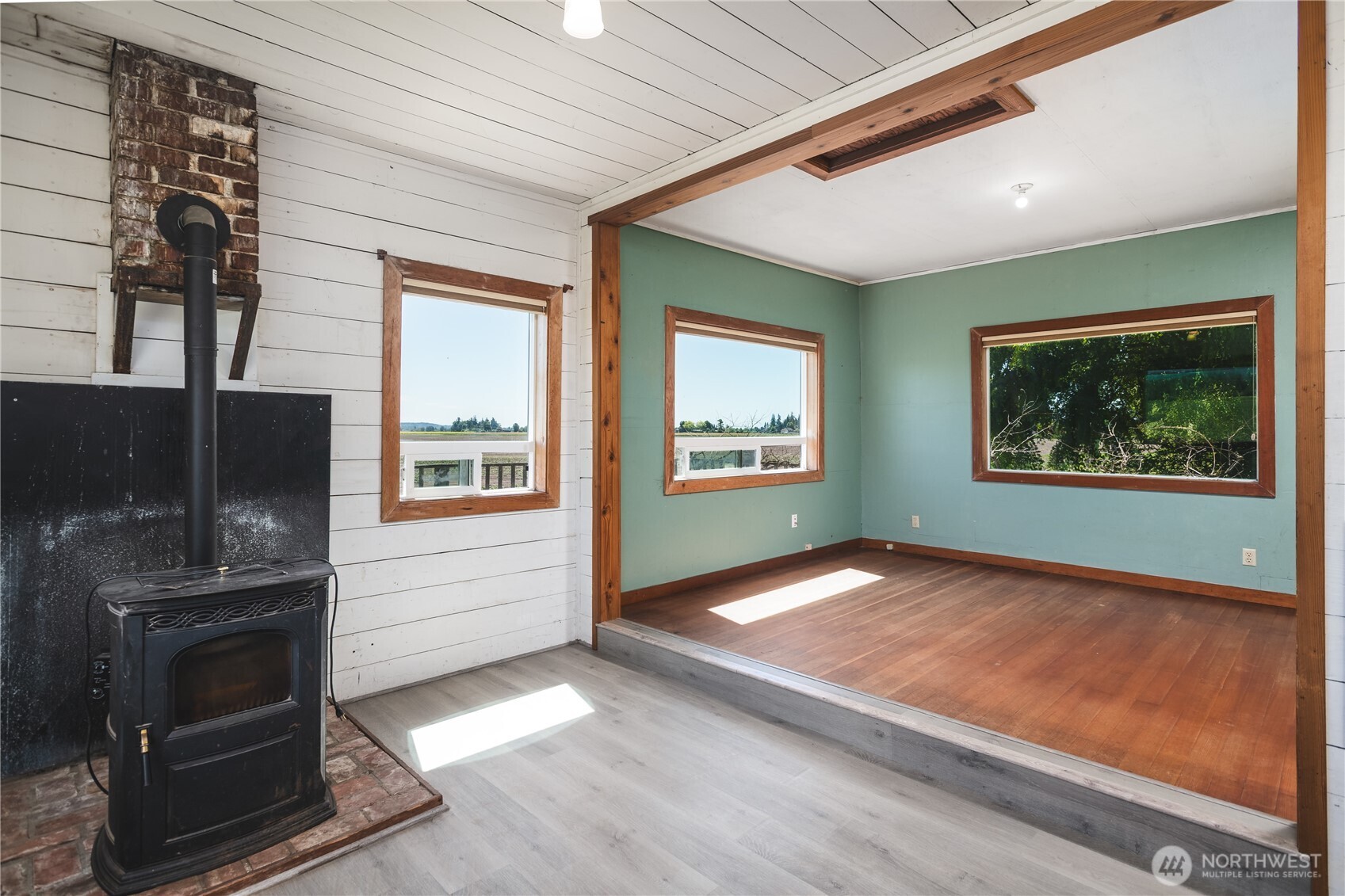 19719 Dry Slough Road Mount Vernon, WA 98273 - Photo 22 of 40 a view of an empty room with a fireplace and a window