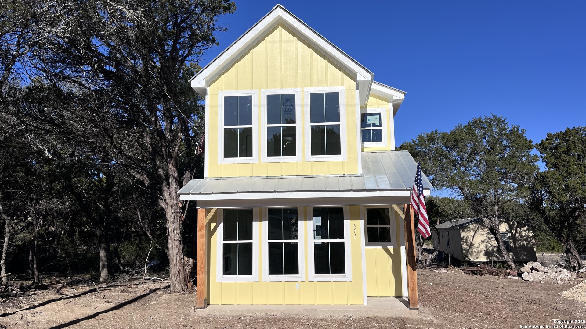 477 Scenic Drive Bandera, TX 78003 - Photo 1 of 22 a view of a house with a yard