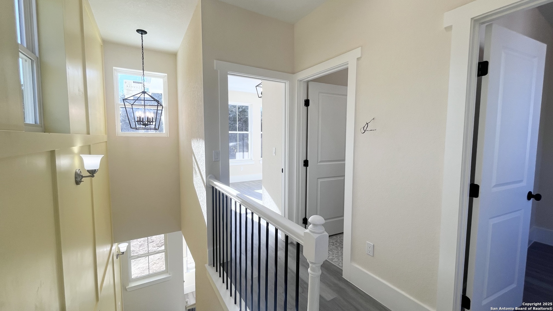 477 Scenic Drive Bandera, TX 78003 - Photo 13 of 22 a view of a hallway with wooden shelves