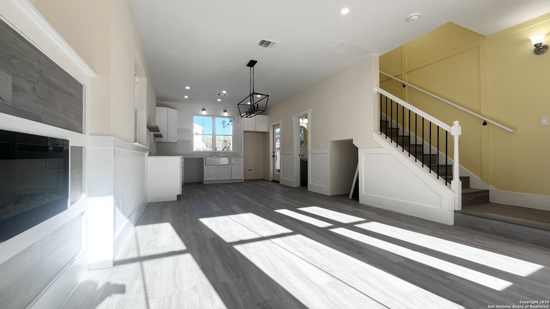 477 Scenic Drive Bandera, TX 78003 - Photo 6 of 22 a view of a kitchen with a sink and a living room