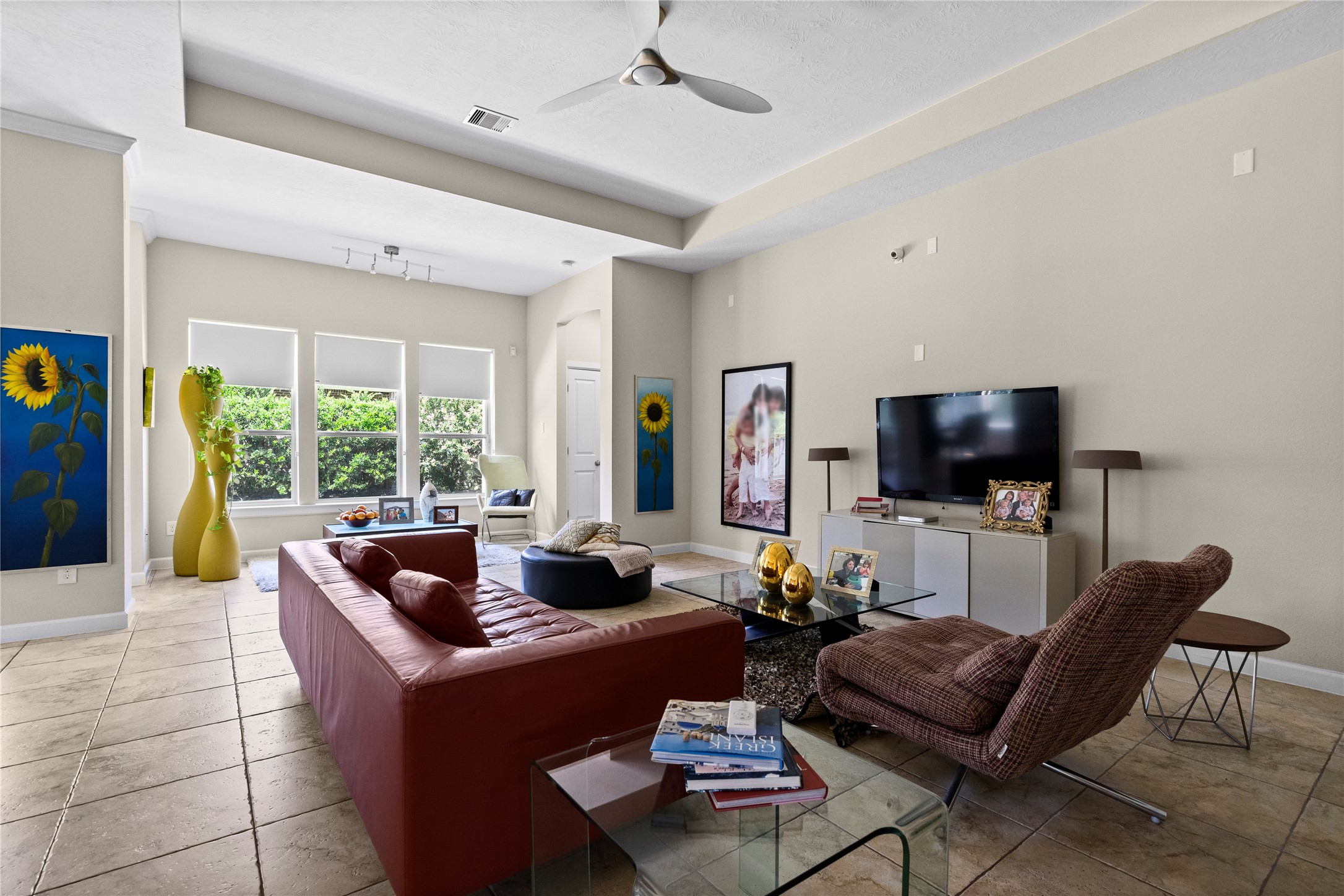 31503 Reston Cliff Court Spring, TX 77386 - Photo 10 of 28 a living room with furniture and a flat screen tv