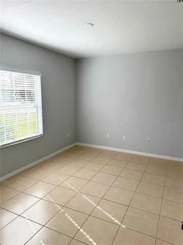 a view of an empty room and a window