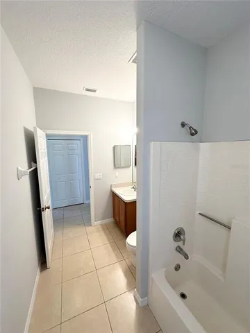 a bathroom with a bathtub sink and toilet