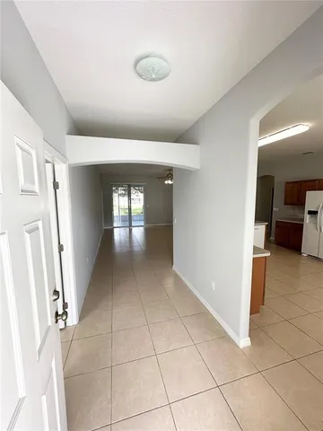 a view of entryway with kitchen