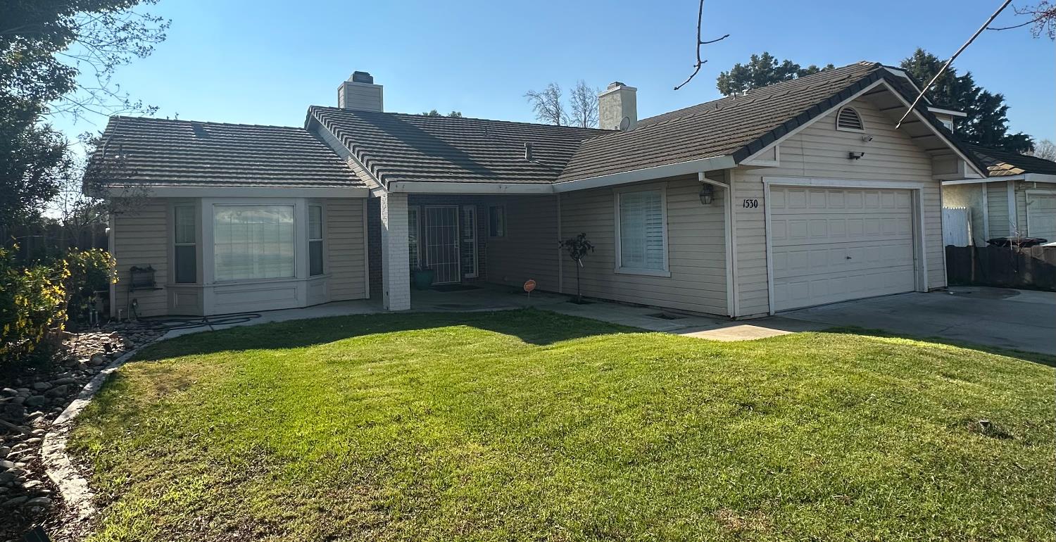 1530 Kinser Road Ceres, CA 95307 - Photo 1 of 1 front view of a house with a yard