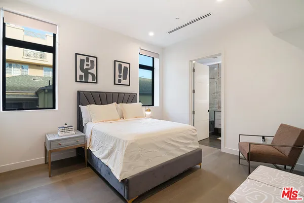 a bedroom with bed and window