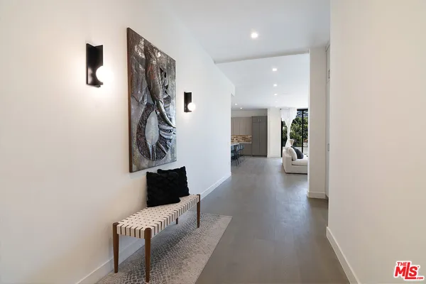 a view of hallway with furniture