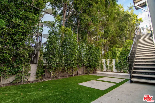 a view of a park with large trees