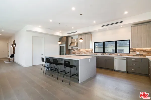 a kitchen with a sink cabinets and counter space