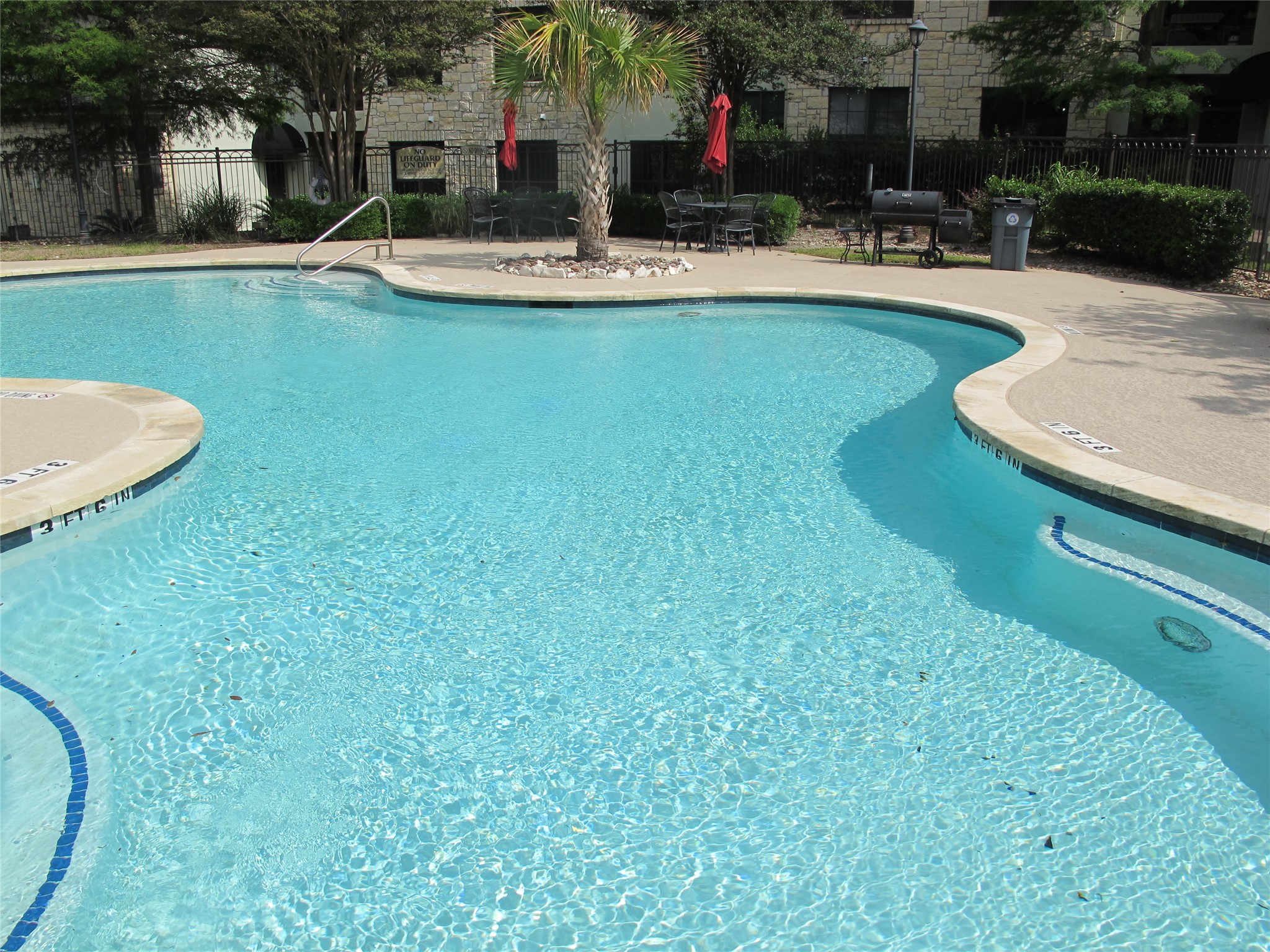 7701 Rialto Boulevard, Unit 1128 Austin, TX 78735 - Photo 33 of 35 a view of a house with swimming pool and sitting area