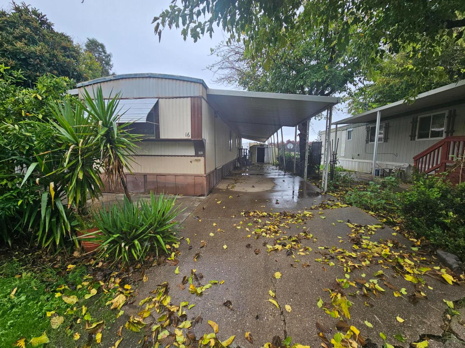 11705 Parey Avenue, Unit 16 Red Bluff, CA 96080 - Photo 1 of 12 a backyard of a house with lots of green space