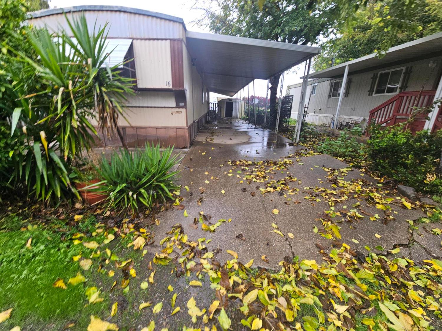 11705 Parey Avenue, Unit 16 Red Bluff, CA 96080 - Photo 2 of 12 a backyard of a house with lots of green space
