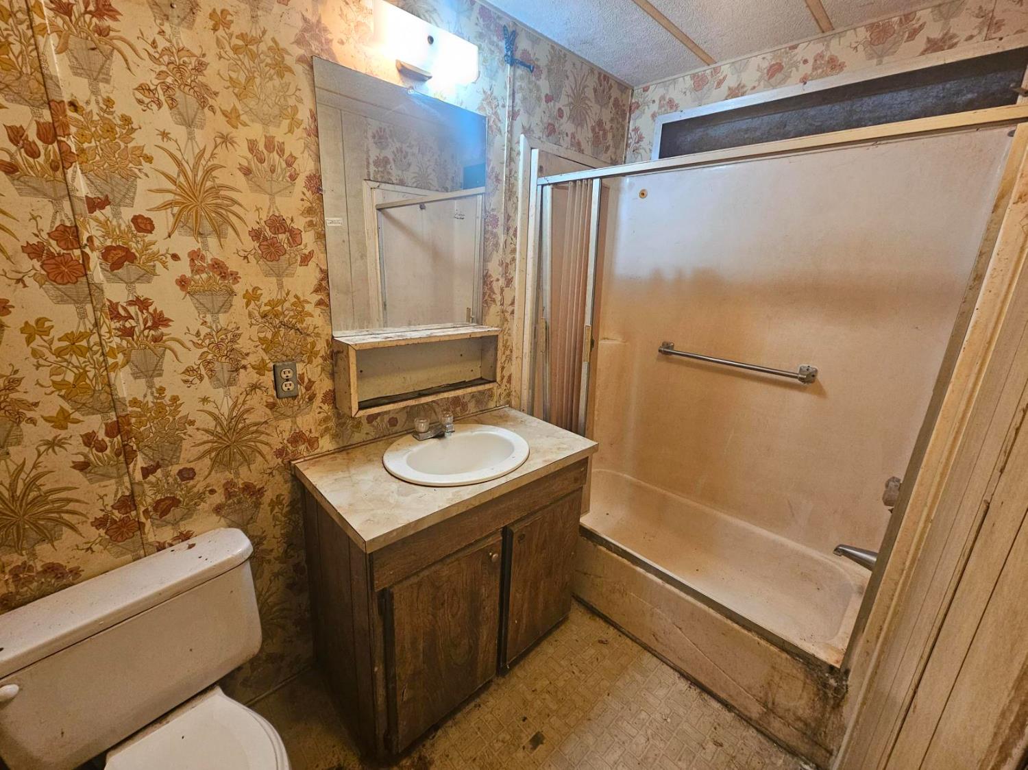 11705 Parey Avenue, Unit 16 Red Bluff, CA 96080 - Photo 5 of 12 a bathroom with a sink toilet and shower