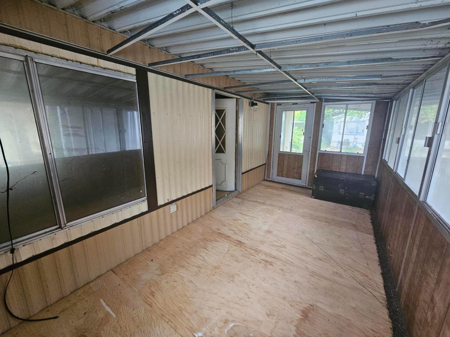 11705 Parey Avenue, Unit 16 Red Bluff, CA 96080 - Photo 6 of 12 a view of empty room with wooden floor and fan