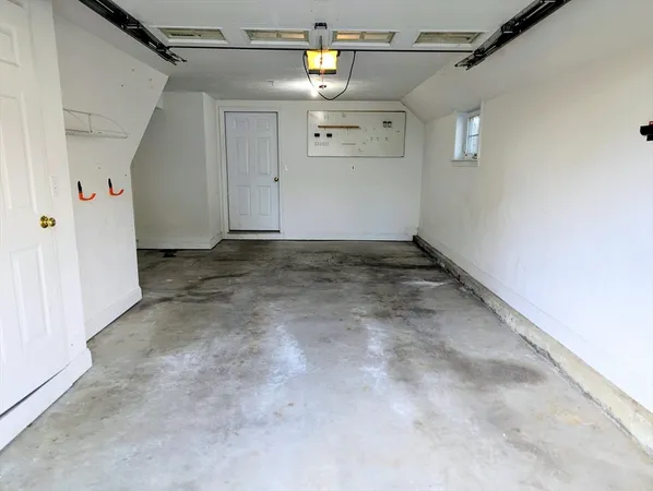 a bathroom with a granite countertop toilet and a sink