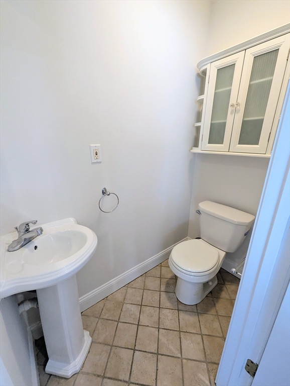 19 Railroad Street, Unit D2 Acton, MA 01720 - Photo 8 of 13 a bathroom with a sink a toilet and mirror
