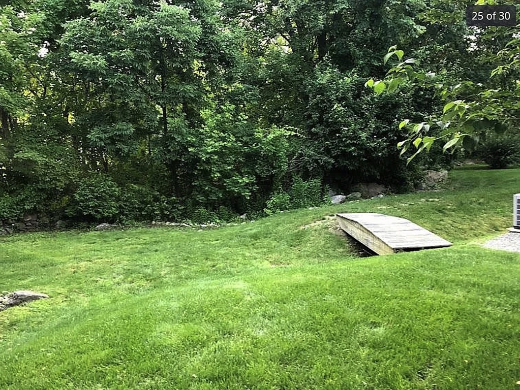 19 Railroad Street, Unit D2 Acton, MA 01720 - Photo 10 of 13 a view of a backyard with a garden