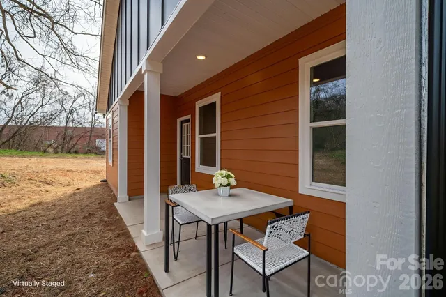 a view of kitchen with sink microwave and refrigerator